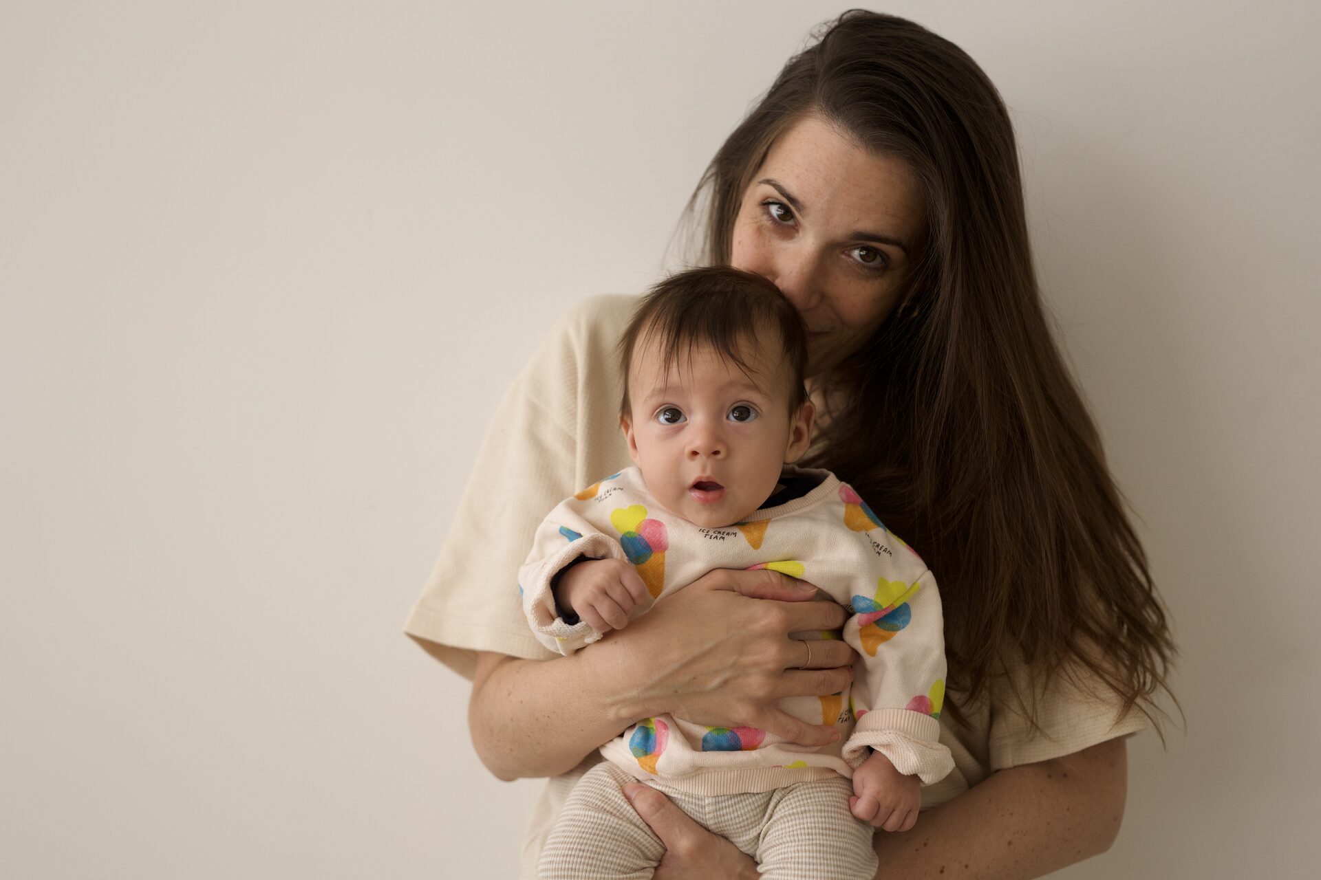 Mother tenderly holding her baby